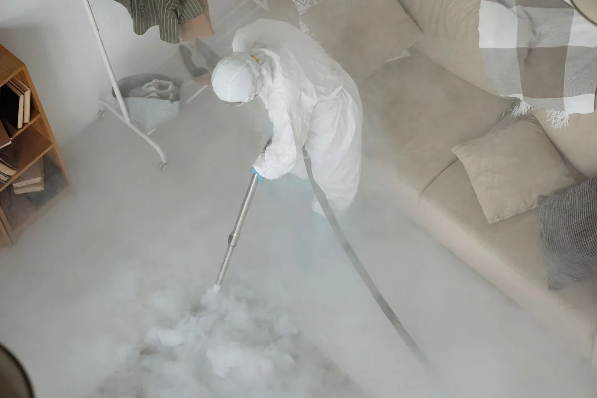 Biohazard cleanup technician in protective equipment, Dora, AL